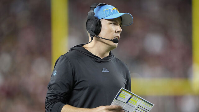 SANTA CLARA, CALIFORNIA - AUGUST 25: Offensive coordinator Kellen Moore of the Los Angeles Chargers looks on from the sidelines against the San Francisco 49ers during the third quarter of a preseason game at Levi's Stadium on August 25, 2023 in Santa Clara, California.