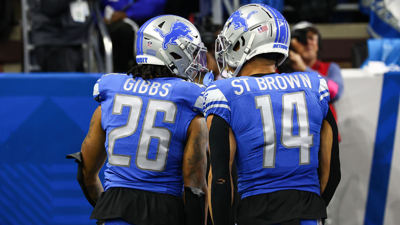DETROIT, MI - JANUARY 21: Detroit Lions running back Jahmyr Gibbs (26) and Detroit Lions wide receiver Amon-Ra St. Brown (14) celebrate after Gibbs scored a touchdown on a running play during an NFL NFC Divisional playoff football game between the Tampa Bay Buccaneers and the Detroit Lions on January 21, 2024 at Ford Field in Detroit, Michigan.