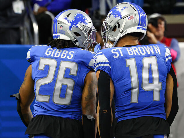 DETROIT, MI - JANUARY 21: Detroit Lions running back Jahmyr Gibbs (26) and Detroit Lions wide receiver Amon-Ra St. Brown (14) celebrate after Gibbs scored a touchdown on a running play during an NFL NFC Divisional playoff football game between the Tampa Bay Buccaneers and the Detroit Lions on January 21, 2024 at Ford Field in Detroit, Michigan.