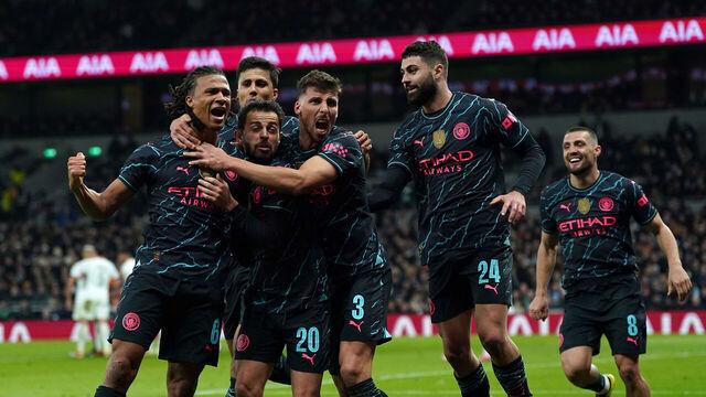 Manchester City's Nathan Ake celebrates scoring their side's first goal of the game with team-mates during the Emirates FA Cup fourth round match at the Tottenham Hotspur Stadium, London. Picture date: Friday January 26, 2024.