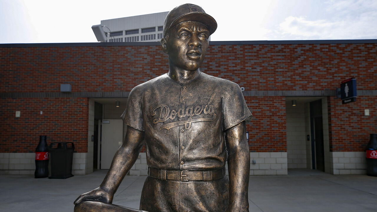 ATLANTA, GA - APRIL 15: A statue of Jackie Robinson stands in the left field stands prior to an MLB game between the Miami Marlins and Atlanta Braves at Truist Park on April 15, 2021 in Atlanta, Georgia. All players are wearing the number 42 in honor of Jackie Robinson Day.