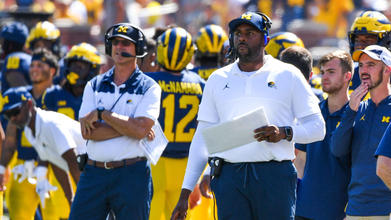 ANN ARBOR, MICHIGAN - SEPTEMBER 03: Head Football Coach Jim Harbaugh (L), Offensive Coordinator / Assistant Football Coach Sherrone Moore (C), and Assistant Football Coach Mimi Bolden-Morris (R) of the Michigan Wolverines are seen on the sideline during a college football game against the Colorado State Rams at Michigan Stadium on September 03, 2022 in Ann Arbor, Michigan.