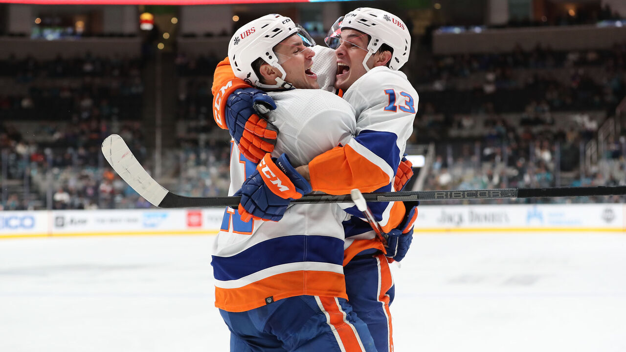SAN JOSE, CA - FEBRUARY 24: Zach Parise #11 and Mathew Barzal #13 celebrate goal in game vs. the San Jose Sharks against the New York Islanders in a regular season game at SAP Center on February 24, 2022 in San Jose, California.