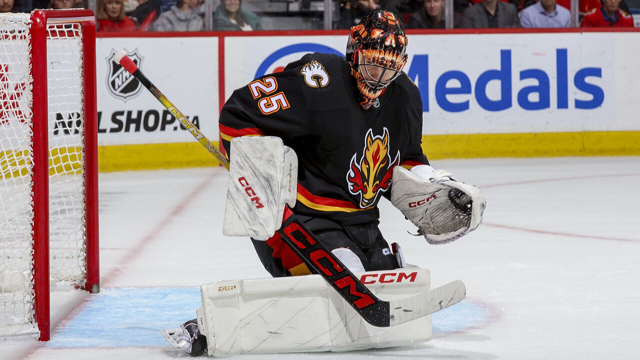CALGARY, AB - JANUARY 23: Jacob Markstrom #25 of the Calgary Flames makes a save against the St Louis Blues at Scotiabank Saddledome on January 23, 2024 in Calgary, Alberta, Canada.