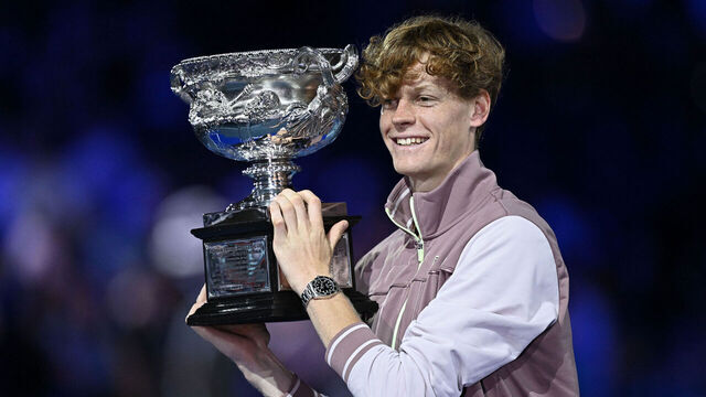 Italy's Jannik Sinner celebrates with the Norman Brookes Challenge Cup trophy after defeating Russia's Daniil Medvedev in the men's singles final match on day 15 of the Australian Open tennis tournament in Melbourne on January 28, 2024.