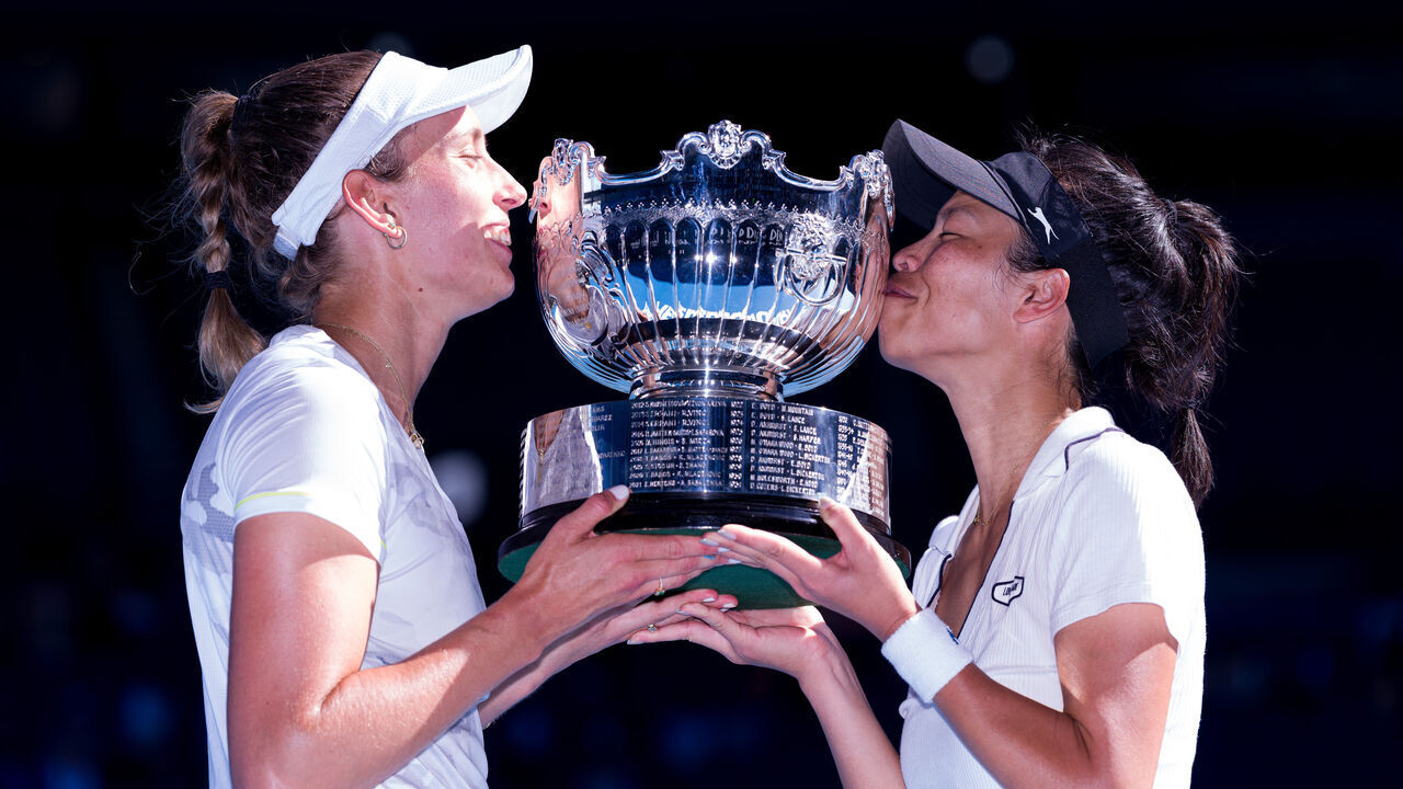 MELBOURNE, AUSTRALIA - JANUARY 28: Su-Wei Hsieh (R) of Chinese Taipei and Elise Mertens of Belgium kiss the championship trophy after winning their Women’s Doubles Finals match against Lyudmyla Kichenok of Ukraine and Jelena Ostapenko of Latvia during the 2024 Australian Open at Melbourne Park on January 28, 2024 in Melbourne, Australia.