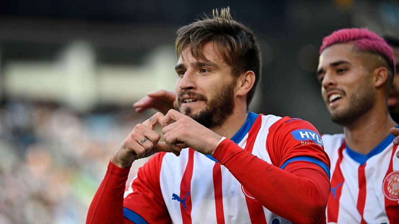 Girona's Spanish forward #24 Cristian Portugues celebrates after scoring his team's first goal during the Spanish league football match between RC Celta de Vigo and Girona FC at the Balaidos stadium in Vigo on January 28, 2024.