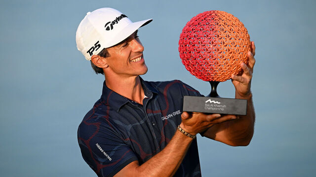 RAS AL KHAIMAH, UNITED ARAB EMIRATES - JANUARY 28: Thorbjorn Olesen of Denmark celebrates victory with the trophy on the 18th green during Day Four of the Ras Al Khaimah Championship at Al Hamra Golf Club on January 28, 2024 in Ras al Khaimah, United Arab Emirates.