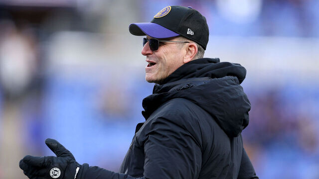BALTIMORE, MARYLAND - JANUARY 20: Head coach Jim Harbaugh of the Michigan Wolverines looks on prior to the AFC Divisional Playoff game between the Baltimore Ravens and the Houston Texans at M&T Bank Stadium on January 20, 2024 in Baltimore, Maryland. Jim's brother, John is the Raven's head coach.
