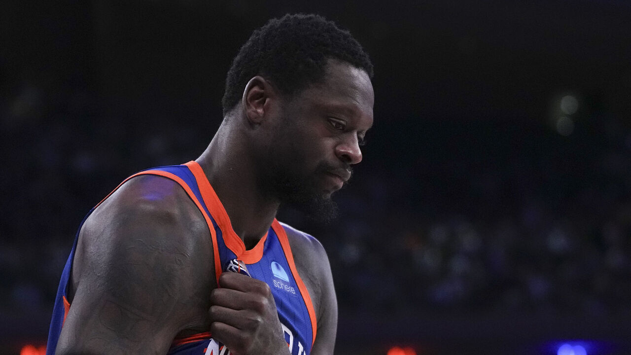 NEW YORK, NEW YORK - JANUARY 27: Julius Randle #30 of the New York Knicks reacts after an injury against the Miami Heat in the second half at Madison Square Garden on January 27, 2024 in New York City. The Knicks defeated the Heat 125-109.