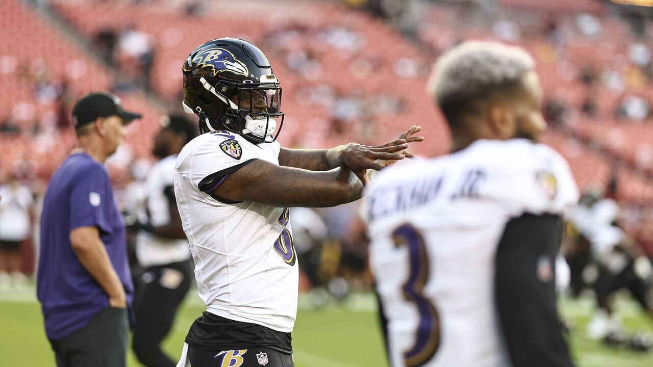 LANDOVER, MARYLAND - AUGUST 21: Lamar Jackson #8 of the Baltimore Ravens reacts as he warms up prior to an NFL preseason game between the Washington Commanders and the Baltimore Ravens at FedExField on August 21, 2023 in Landover, Maryland.