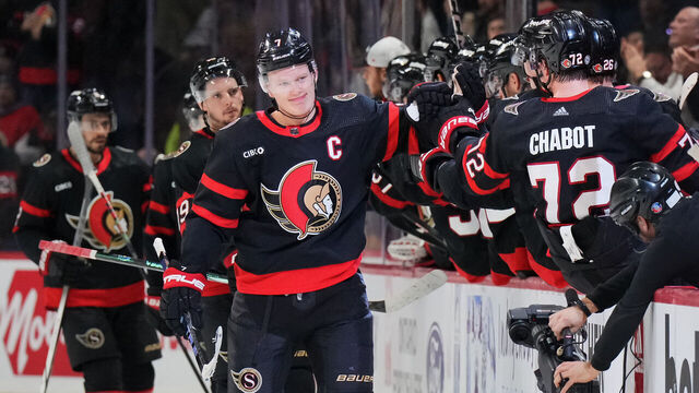 OTTAWA, CANADA - JANUARY 29: Brady Tkachuk #7 of the Ottawa Senators celebrates his second period goal against the Nashville Predators with teammates at the players' bench at Canadian Tire Centre on January 29, 2024 in Ottawa, Ontario, Canada.