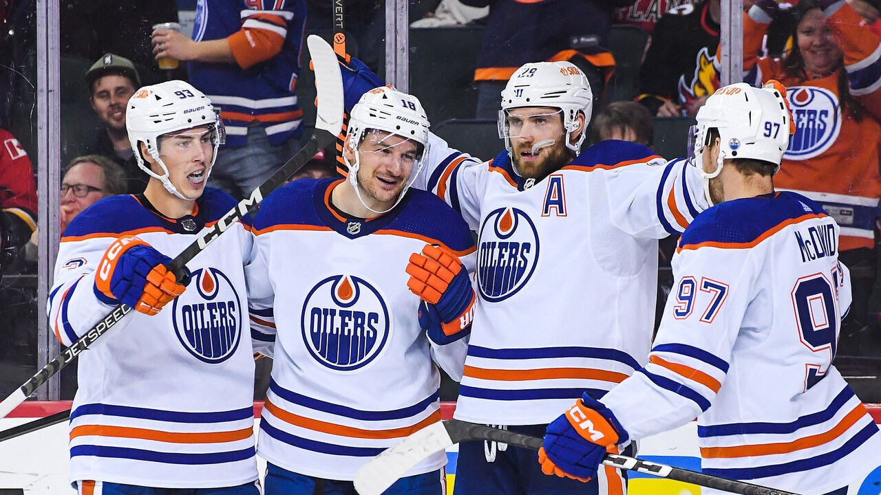 CALGARY, CANADA - OCTOBER 29: (L to R) Ryan Nugent-Hopkins #93, Zach Hyman #18, Leon Draisaitl #29 and Connor McDavid #97 of the Edmonton Oilers celebrate after Hyman scored against the Calgary Flames during the second period of an NHL game at Scotiabank Saddledome on October 29, 2022 in Calgary, Alberta, Canada.