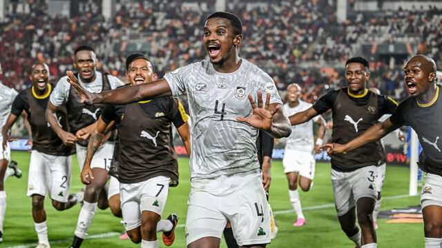 South Africa's midfielder #4 Teboho Mokoena (C) celebrates with teammates after scoring a goal during the Africa Cup of Nations (CAN) 2024 round of 16 football match between Morocco and South Africa at the Stade Laurent Pokou in San Pedro on January 30, 2024.