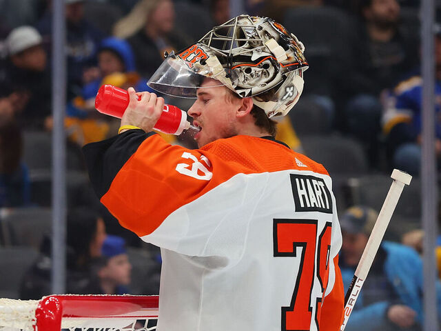 ST LOUIS, MISSOURI - JANUARY 15: Carter Hart #79 of the Philadelphia Flyers takes a drink during a game against the St. Louis Blues at Enterprise Center on January 15, 2024 in St Louis, Missouri.