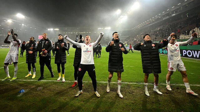 HAMBURG, GERMANY - JANUARY 30: The players and coaching staff of Fortuna Duesseldorf celebrate after victory after the DFB cup quarterfinal match between FC St. Pauli and Fortuna Düsseldorf at Millerntor Stadium on January 30, 2024 in Hamburg, Germany.