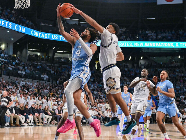ATLANTA, GA JANUARY 30: Georgia Tech guard Kyle Sturdivant (1) blocks the shot of North Carolina guard RJ Davis (4) during the college basketball game between the North Carolina Tar Heels and the Georgia Tech Yellow Jackets on January 30th, 2024 at Hank McCamish Pavilion in Atlanta, GA.