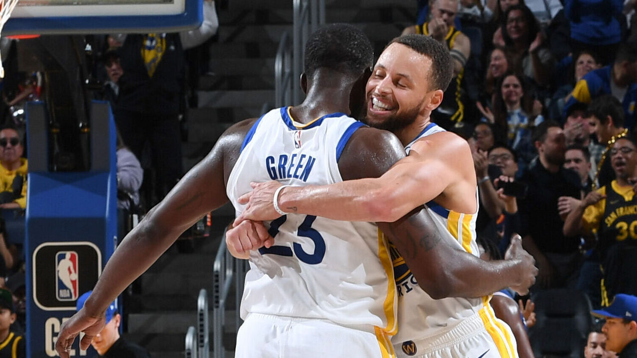SAN FRANCISCO, CA - JANUARY 30: Stephen Curry #30 of the Golden State Warriors & Draymond Green #23 of the Golden State Warriors embrace during the game on January 30, 2024 at Chase Center in San Francisco, California. NOTE TO USER: User expressly acknowledges and agrees that, by downloading and or using this photograph, user is consenting to the terms and conditions of Getty Images License Agreement. Mandatory Copyright Notice: Copyright 2024 NBAE
