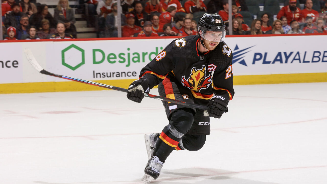 CALGARY, ALBERTA - NOVEMBER 18: Elias Lindholm #28 of the Calgary Flames skates against the Vancouver Canucks at the Scotiabank Saddledome on November 18, 2023 in Calgary, Alberta.