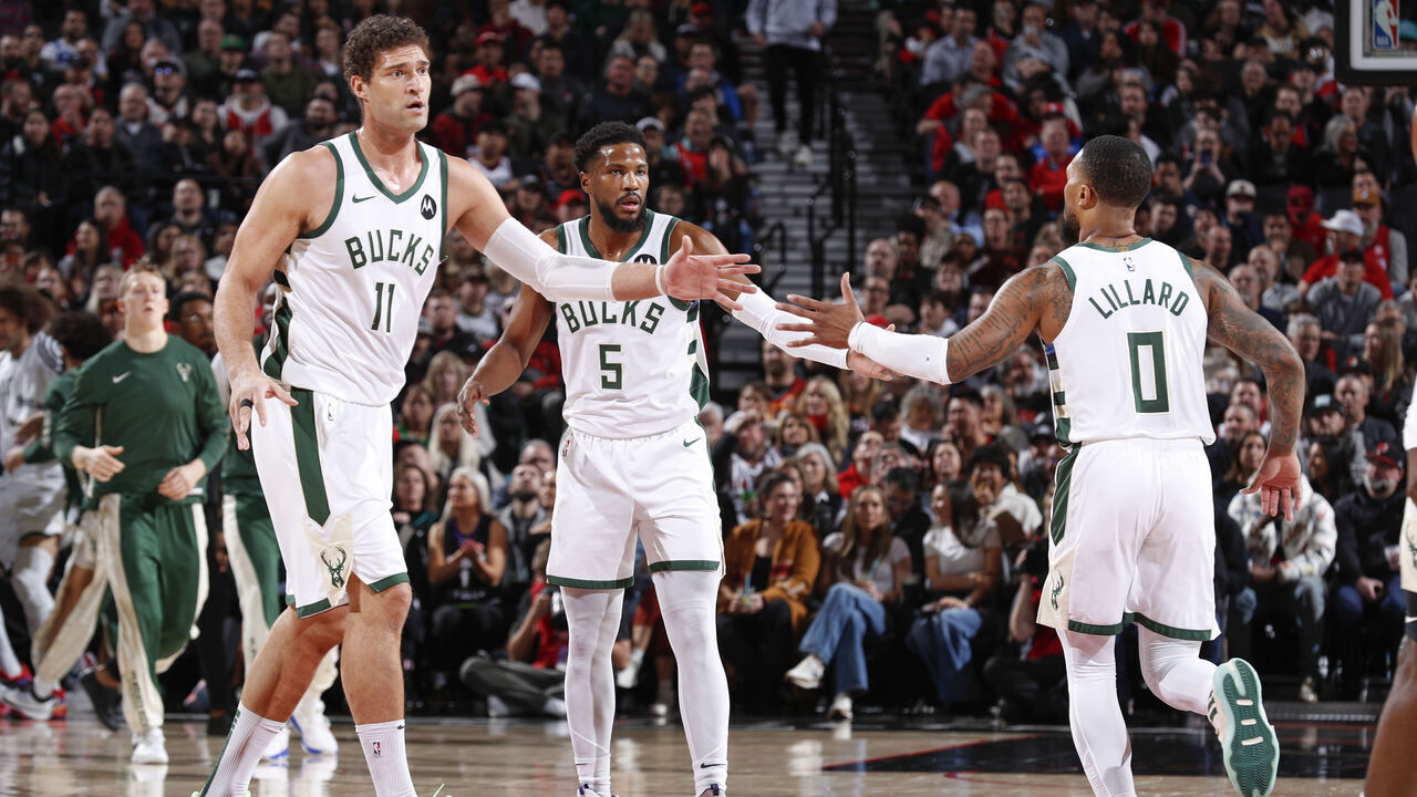 PORTLAND, OR - JANUARY 31: Brook Lopez #11 of the Milwaukee Bucks Malik Beasley #5 of the Milwaukee Bucks & Damian Lillard #0 of the Milwaukee Bucks high five during the game on January 31, 2024 at the Moda Center Arena in Portland, Oregon. Mandatory Copyright Notice: Copyright 2024 NBAE