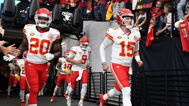 LAS VEGAS, NEVADA - NOVEMBER 26: Patrick Mahomes #15 and Justin Reid #20 of the Kansas City Chiefs lead the team onto the field prior to a game against the Las Vegas Raiders at Allegiant Stadium on November 26, 2023 in Las Vegas, Nevada.