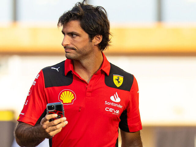 ABU DHABI, UNITED ARAB EMIRATES - NOVEMBER 28: Carlos Sainz of Spain and Ferrari F1 team walks in the paddock during Formula 1 testing at Yas Marina Circuit on November 28, 2023 in Abu Dhabi, United Arab Emirates.