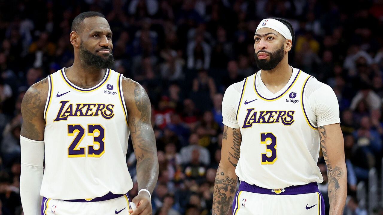 SAN FRANCISCO, CALIFORNIA - JANUARY 27: LeBron James #23 and Anthony Davis #3 of the Los Angeles Lakers stand on the court together during their game against the Golden State Warriors at Chase Center on January 27, 2024 in San Francisco, California.