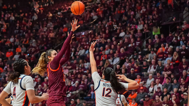 BLACKSBURG, VA - FEBRUARY 01: Virginia Tech Hokies center Elizabeth Kitley (33) shoots over defender Virginia Cavaliers forward Edessa Noyan (12) during a college basketball game between the Virginia Cavaliers and the Virginia Tech Hokies on February 1, 2024 at Cassell Coliseum in Blacksburg, VA.