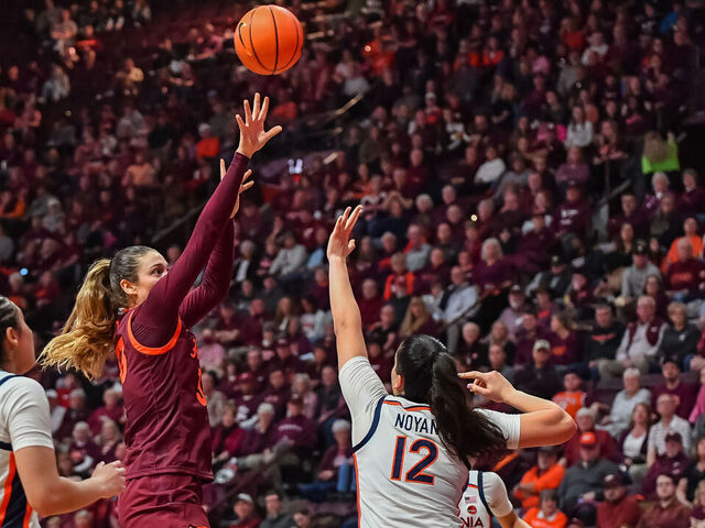 BLACKSBURG, VA - FEBRUARY 01: Virginia Tech Hokies center Elizabeth Kitley (33) shoots over defender Virginia Cavaliers forward Edessa Noyan (12) during a college basketball game between the Virginia Cavaliers and the Virginia Tech Hokies on February 1, 2024 at Cassell Coliseum in Blacksburg, VA.