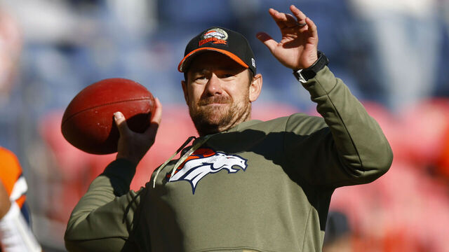 DENVER, COLORADO - NOVEMBER 20: Klint Kubiak quarterbacks coach for the Denver Broncos throws a pass during warmups prior to a game against the Las Vegas Raiders at Empower Field At Mile High on November 20, 2022 in Denver, Colorado.