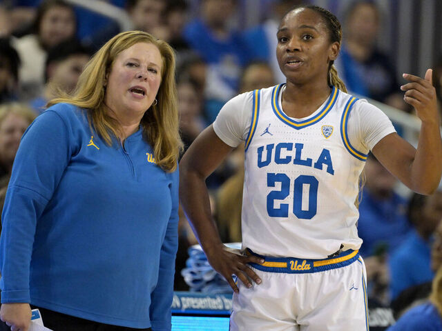 LOS ANGELES, CALIFORNIA - JANUARY 26: Head coach Cori Close talks with Charisma Osborne #20 of the UCLA Bruins in the game against the Washington Huskies at UCLA Pauley Pavilion on January 26, 2024 in Los Angeles, California.