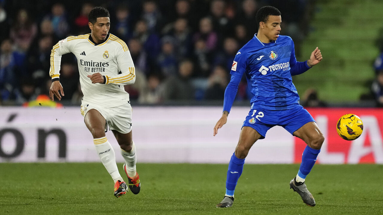 Mason Greenwood right winger of Getafe and England and Jude Bellingham central midfield of Real Madrid and England compete for the ball during the LaLiga EA Sports match between Getafe CF and Real Madrid CF at Coliseum Alfonso Perez on February 1, 2024 in Getafe, Spain.