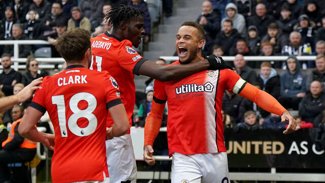 Luton Town's Carlton Morris (right) celebrates with team-mate Elijah Adebayo (centre) and Jordan Clark after scoring their side's third goal of the game from the penalty spot during the Premier League match at St. James' Park, Newcastle upon Tyne. Picture date: Saturday February 3, 2024.