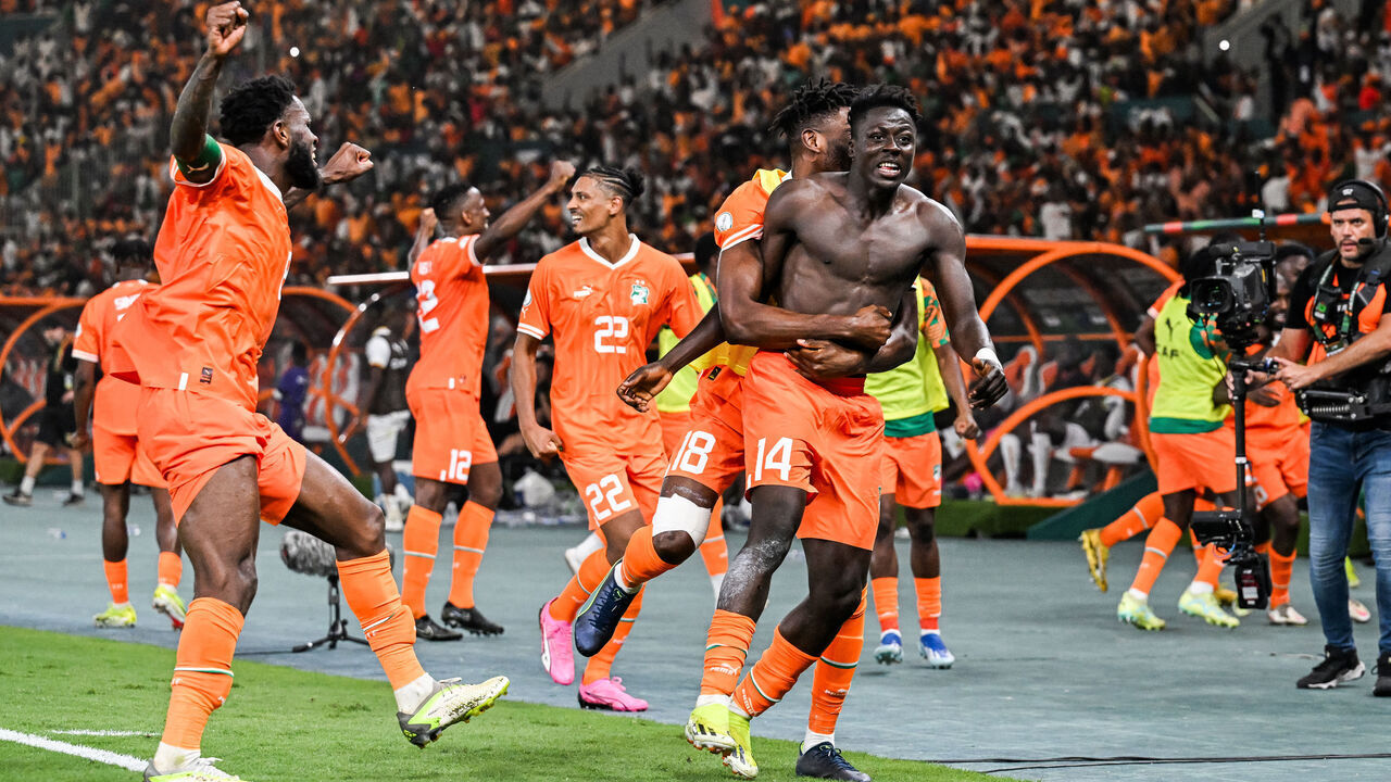 Ivory Coast's forward #14 Oumar Diakite (C) takes his jersey off as he celebrates with teammates after scoring his team's second goal during the Africa Cup of Nations (CAN) 2024 quarter-final football match between Mali and Ivory Coast at the Stade de la Paix in Bouake on February 3, 2024.