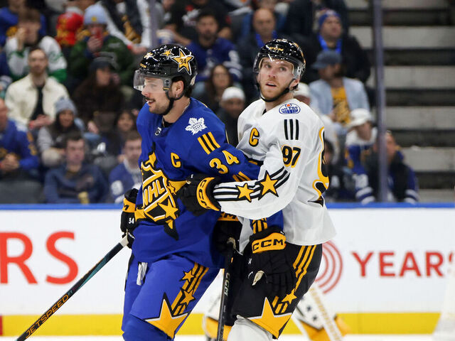 TORONTO, ONTARIO - FEBRUARY 03: Auston Matthews #34 of the Toronto Maple Leafs gets tied up with Connor McDavid #97 of the Edmonton Oilers during the game between Team Matthews and Team McDavid during the 2024 Honda NHL All-Star Game on February 03, 2024 in Toronto, Ontario.