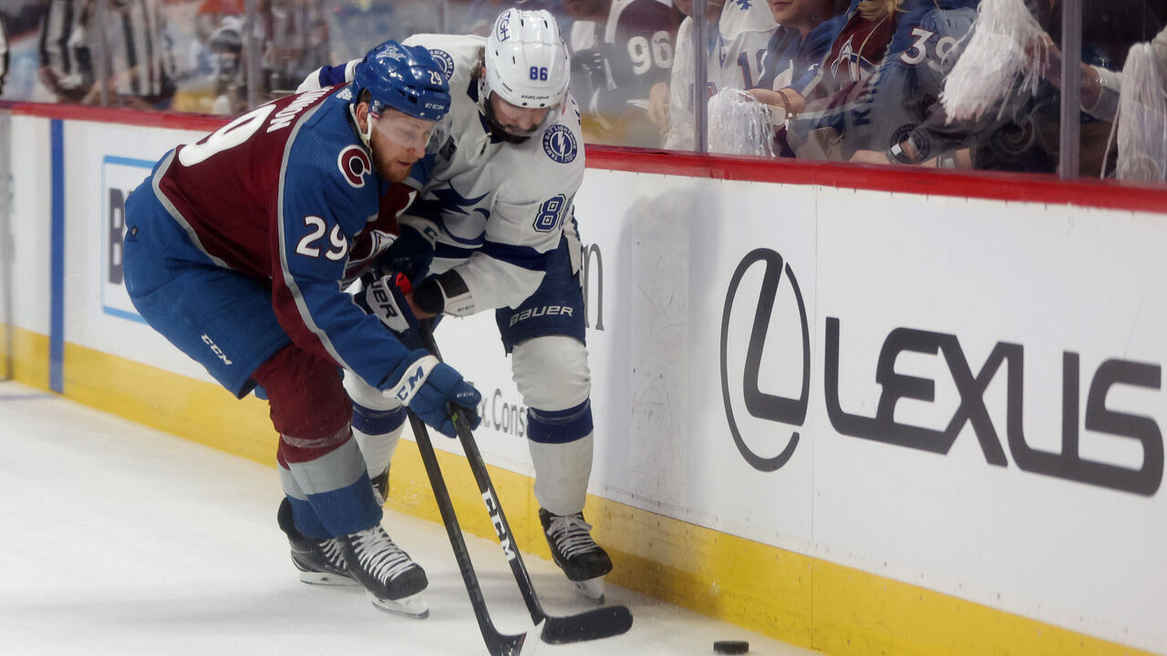 DENVER, COLORADO - JUNE 18: Nathan MacKinnon #29 of the Colorado Avalanche and Nikita Kucherov #86 of the Tampa Bay Lightning chase after the puck during the first period in Game Two of the 2022 NHL Stanley Cup Final at Ball Arena on June 18, 2022 in Denver, Colorado.