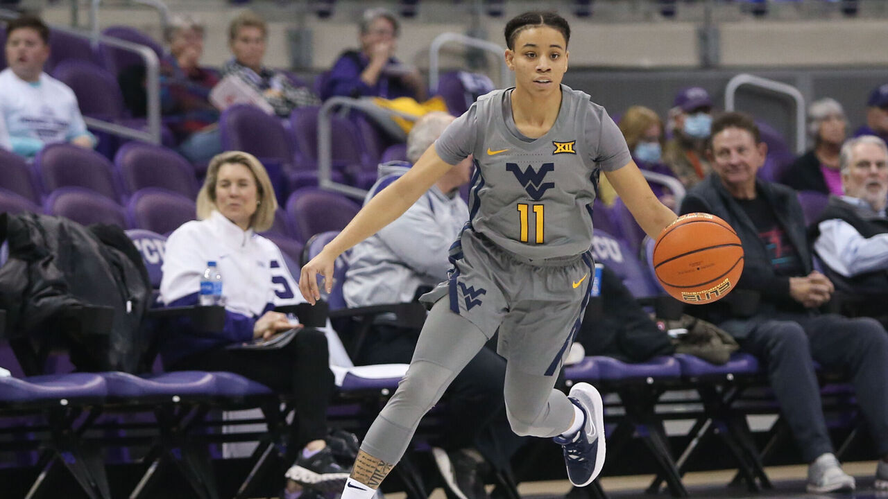 FORT WORTH, TX - FEBRUARY 02: West Virginia Mountaineers guard Ja'Naiya Quinerly (11) drives to the basket during the game between TCU and West Virginia on February 2, 2022 at Ed & Rae Schollmaier Arena in Fort Worth, TX.