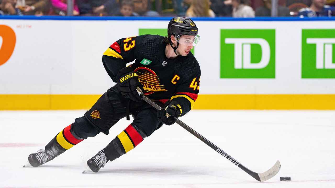 VANCOUVER, BC - JANUARY 27: Vancouver Canucks defenseman Quinn Hughes (43) skates with the puck during an NHL game between the Columbus Blue Jackets and the Vancouver Canucks on Saturday, January 27, 2024 at Rogers Arena in Vancouver, B.C.