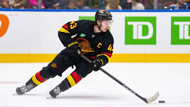 VANCOUVER, BC - JANUARY 27: Vancouver Canucks defenseman Quinn Hughes (43) skates with the puck during an NHL game between the Columbus Blue Jackets and the Vancouver Canucks on Saturday, January 27, 2024 at Rogers Arena in Vancouver, B.C.