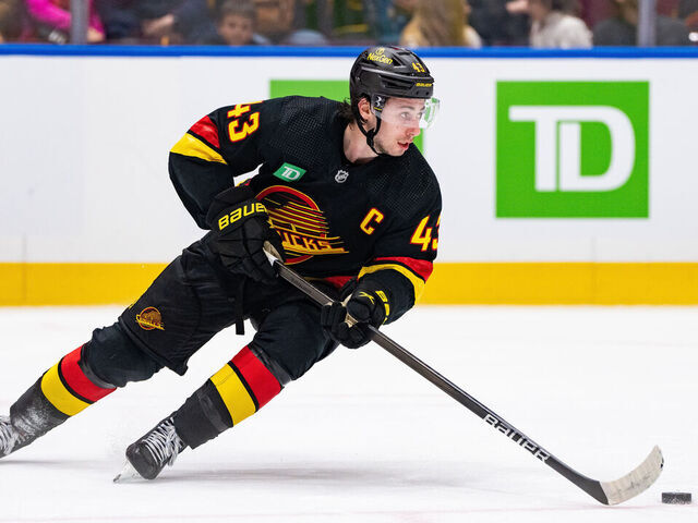 VANCOUVER, BC - JANUARY 27: Vancouver Canucks defenseman Quinn Hughes (43) skates with the puck during an NHL game between the Columbus Blue Jackets and the Vancouver Canucks on Saturday, January 27, 2024 at Rogers Arena in Vancouver, B.C.