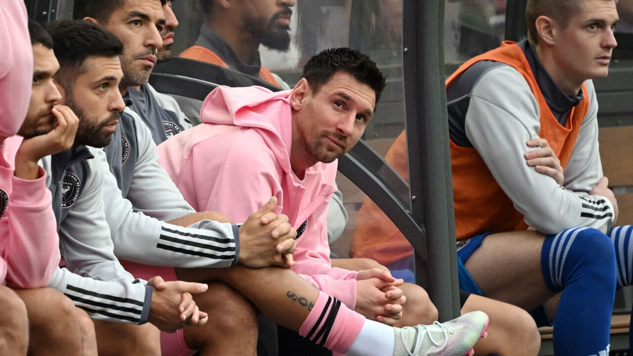 Inter Miami's Argentine forward Lionel Messi (C) sits on the bench during the friendly football match between Hong Kong XI and US Inter Miami CF in Hong Kong on February 4, 2024. Inter Miami were booed off the pitch after their injured superstar Lionel Messi failed to take the field in a pre-season friendly in Hong Kong.