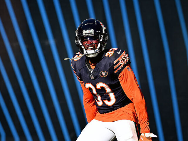CHICAGO, ILLINOIS - OCTOBER 22: Jaylon Johnson #33 of the Chicago Bears reacts after an interception during the second half against the Las Vegas Raiders at Soldier Field on October 22, 2023 in Chicago, Illinois.
