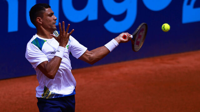 SANTIAGO, CHILE - OCTOBER 25: Thiago Monteiro of Brazil plays a forehand against Gonzalo Lama of Chile during the Men's Singles 1/8 Finals as part of the Santiago 2023 Pan Am Games at Centro Deportivo de Tenis on October 25, 2023 in Santiago, Chile.