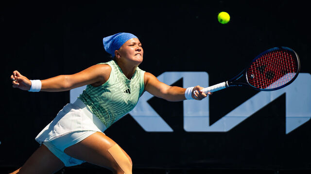 MELBOURNE, AUSTRALIA - JANUARY 15: Diana Shnaider in action against Jasmine Paolini of Italy in the women's singles first round match on Day 2 of the 2024 Australian Open at Melbourne Park on January 15, 2024 in Melbourne, Australia.