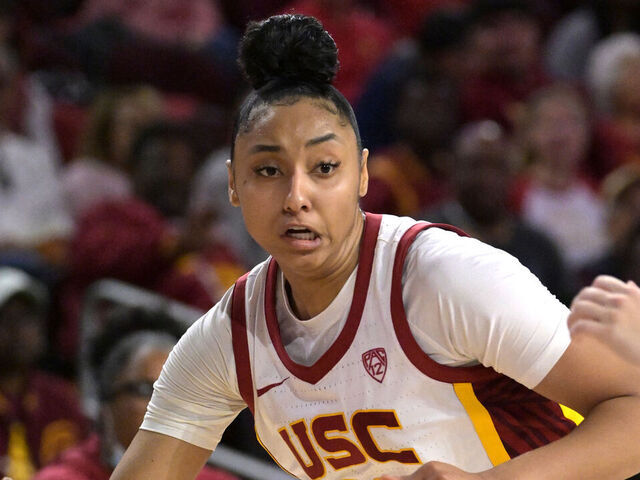 LOS ANGELES, CALIFORNIA - JANUARY 28: JuJu Watkins #12 of the USC Trojans handles the ball against the Washington Huskies at Galen Center on January 28, 2024 in Los Angeles, California.