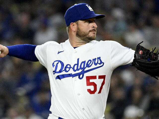 Los Angeles, CA - September 20: Relief pitcher Ryan Brasier #57 of the Los Angeles Dodgers throws to the plate against the Detroit Tigers in the seventh inning of a baseball game at Dodger Stadium in Los Angeles on Wednesday, September 20, 2023.