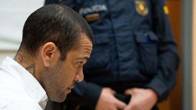 Brazilian footballer Dani Alves looks on at the start of his trial at the High Court of Justice of Catalonia in Barcelona, on February 5, 2024. Brazilian footballer Dani Alves, a former star at Barca and PSG, goes on trial in Barcelona accused of raping a woman in a local nightclub. Prosecutors are asking for a nine-year prison sentence, followed by 10 years of conditional liberty. They are also asking he pay 150,000 euros ($162,000) in compensation to the woman.