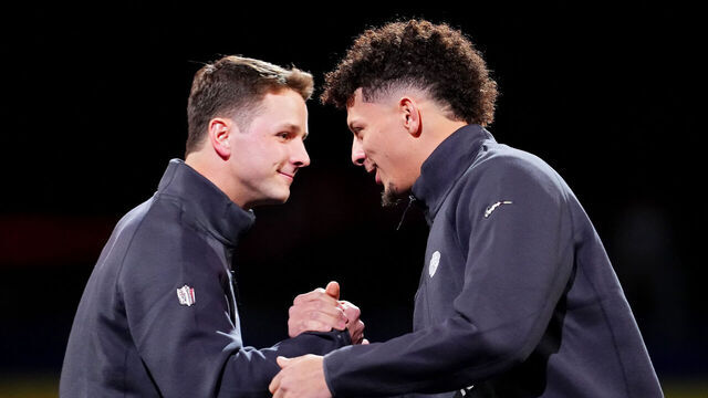LAS VEGAS, NEVADA - FEBRUARY 05: Brock Purdy of the San Francisco 49ers (L) and Patrick Mahomes of the Kansas City Chiefs meet on stage during Super Bowl LVIII Opening Night at Allegiant Stadium on February 05, 2024 in Las Vegas, Nevada.