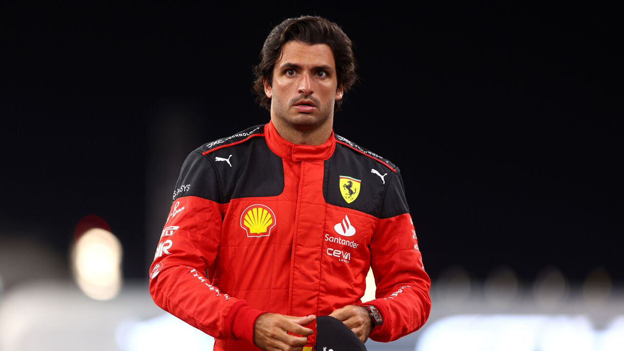 ABU DHABI, UNITED ARAB EMIRATES - NOVEMBER 23: Carlos Sainz of Spain and Ferrari looks on at the Ferrari Team Photo during previews ahead of the F1 Grand Prix of Abu Dhabi at Yas Marina Circuit on November 23, 2023 in Abu Dhabi, United Arab Emirates.
