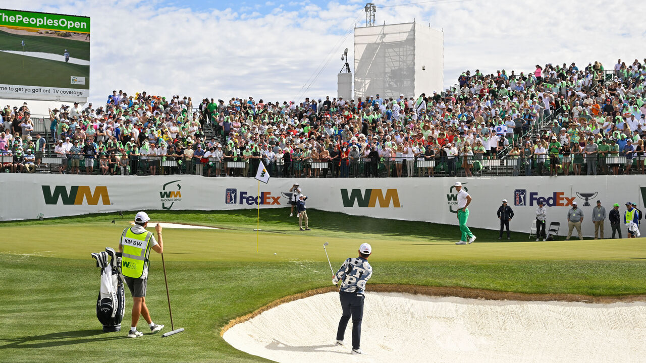 SCOTTSDALE, ARIZONA - FEBRUARY 11: Si Woo Kim of South Korea hits a shot from the bunker on the 16th hole during the third round of the WM Phoenix Open at TPC Scottsdale on February 11, 2023 in Scottsdale, Arizona.
